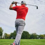 Skilled golfer perfecting the golf swing outside